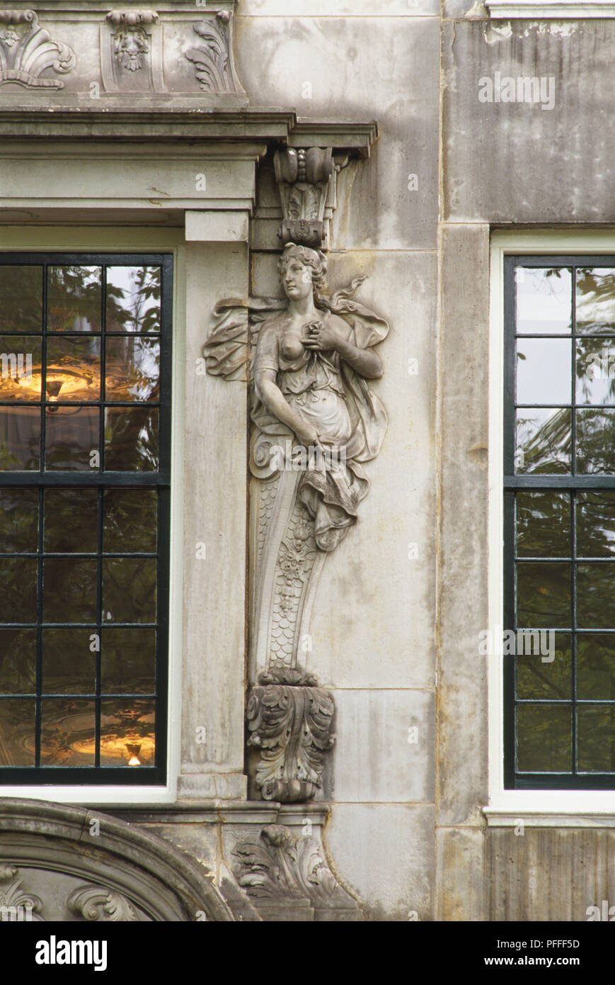 Holland, Amsterdam, window decoration of house lining Herengracht canal