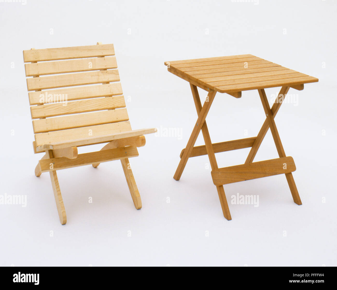 Stowable wooden table and chair. Stock Photo