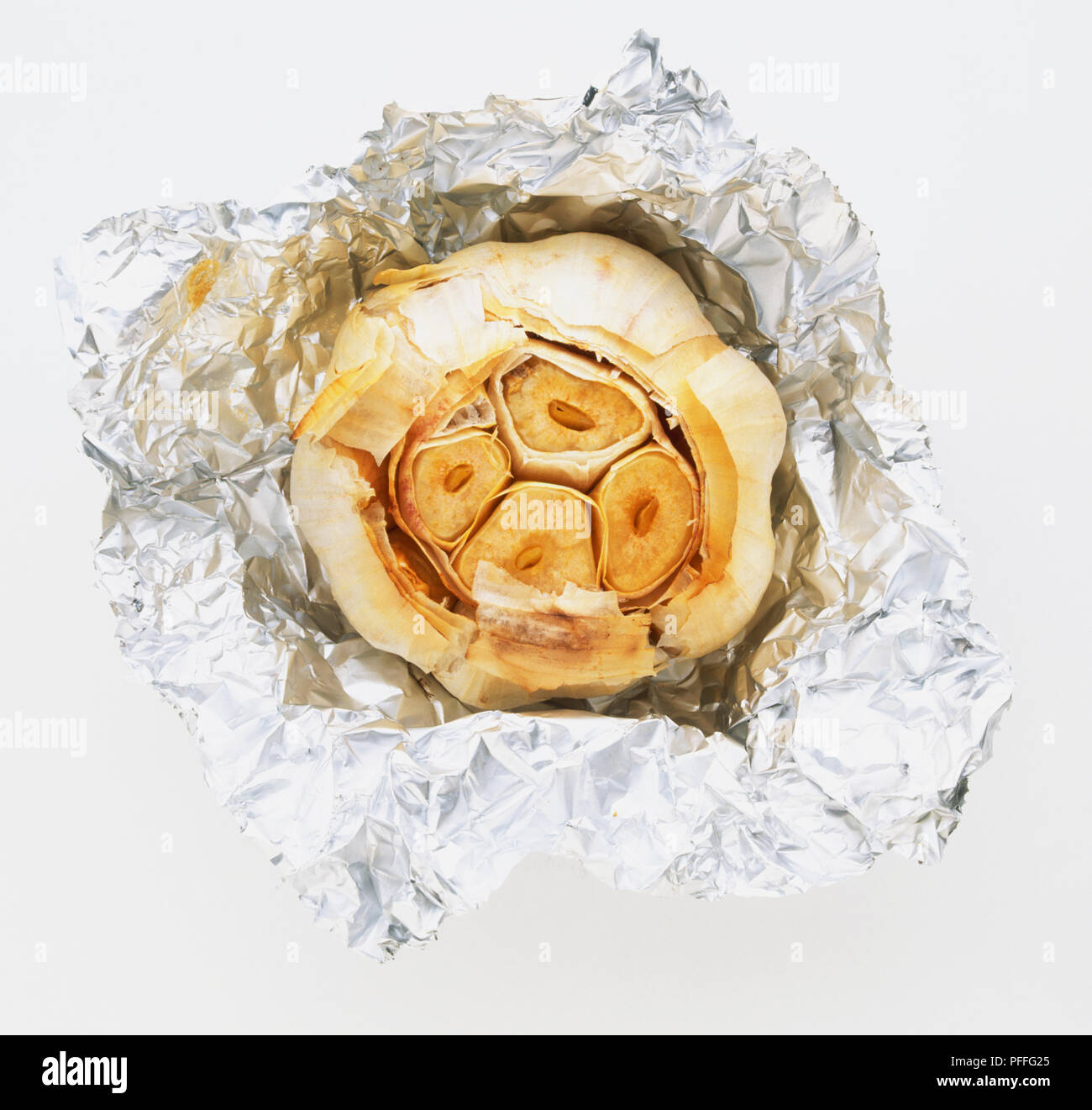 Garlic bulb roasted in foil Stock Photo Alamy