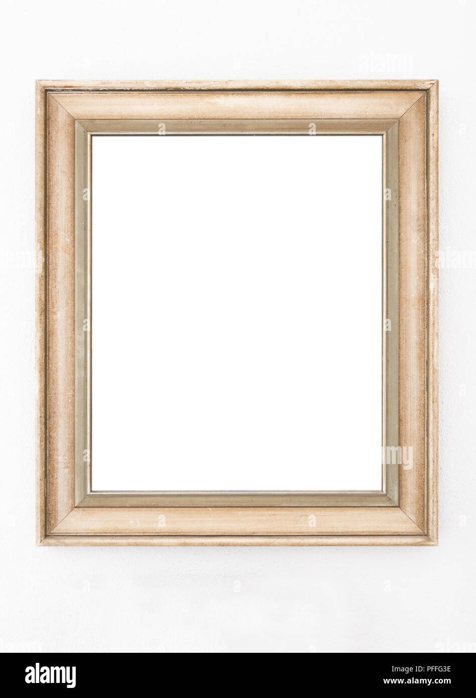 empty ornate picture frame hanging on wall Stock Photo