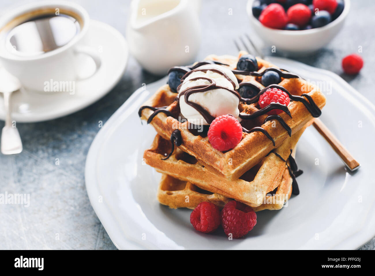 Belgian Waffles With Berries Ice Cream And Chocolate Sauce Closeup View Selective Focus Stock Photo Alamy