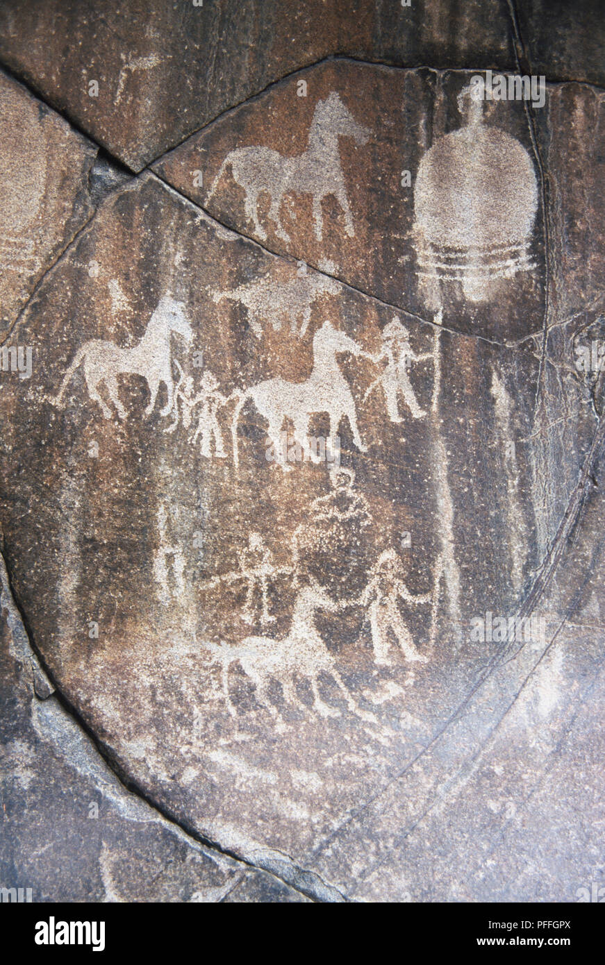 Images of animals and symbols are amongst the 30,000 rock carvings near the village of Chilas in the Karakoram mountain range of northern Pakistan. Stock Photo