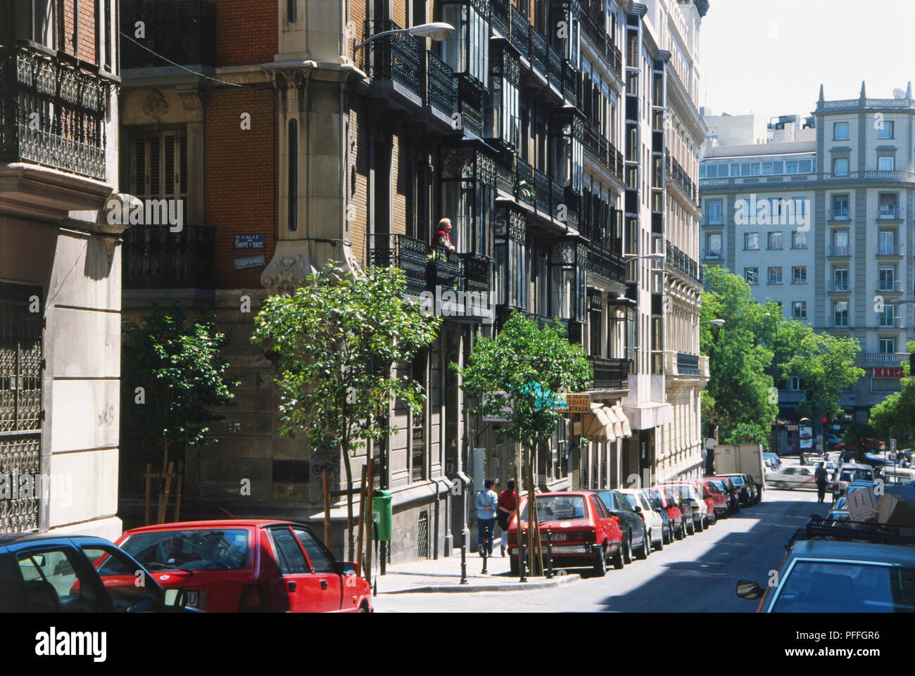 Spain, Madrid, Calle del Almirante, parked cars lining fashionable street. Stock Photo