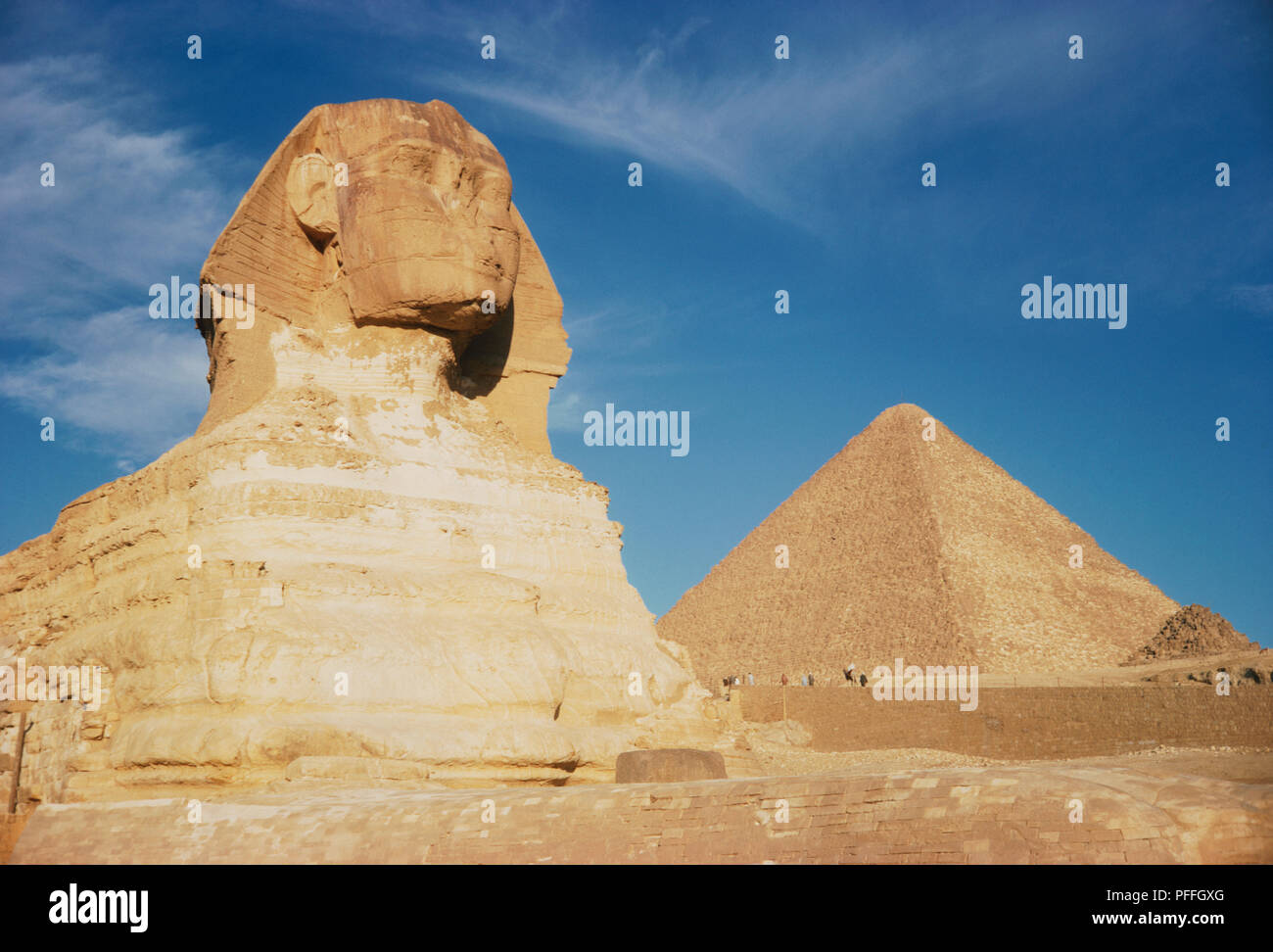 Egypt, Giza, The Sphinx against the Great Pyramid of Cheops Stock Photo ...