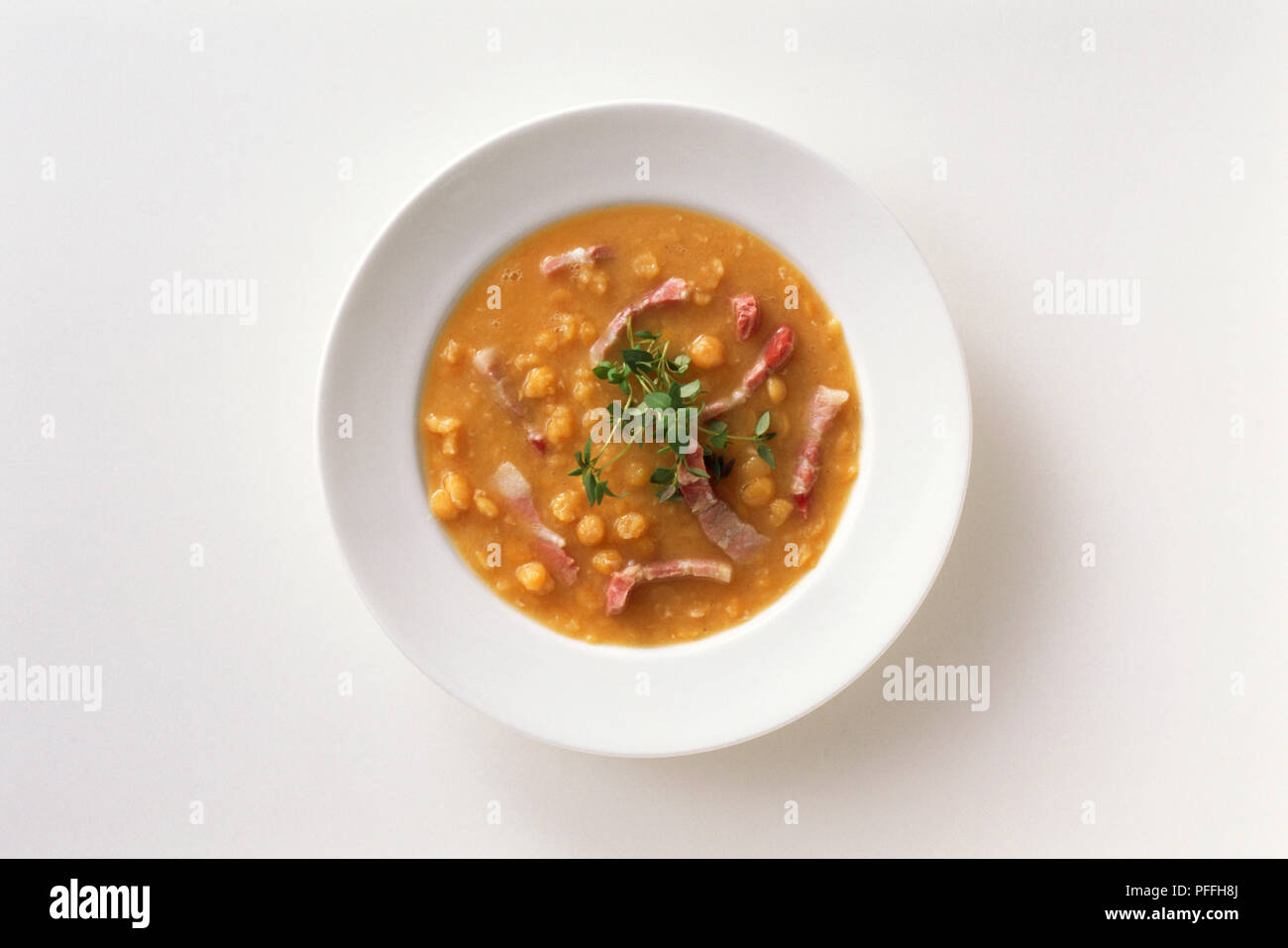Sweden, Stockholm, overhead view of a white soup dish containing pea soup accompanied by lightly salted meat, traditionally served on Thursdays, national dish Stock Photo