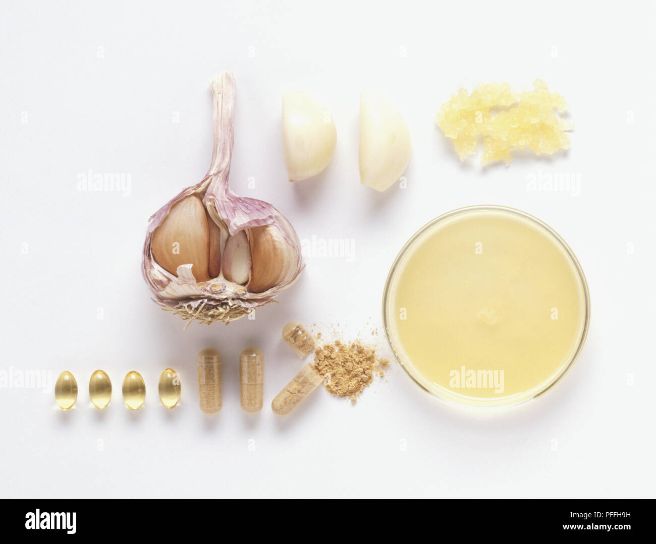 Garlic, cross section of bulb, peeled cloves, crushed garlic and capsules Stock Photo Alamy