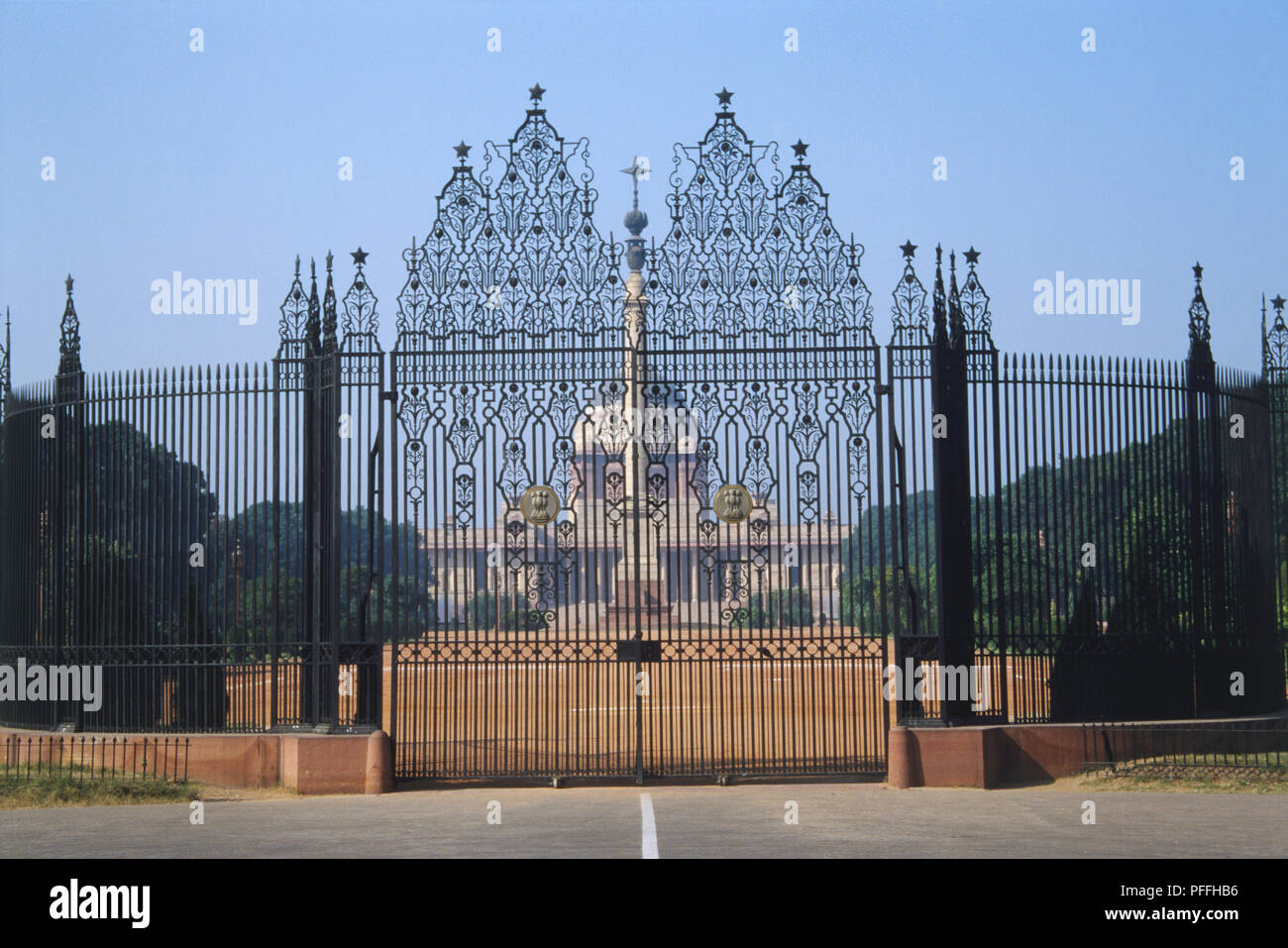 India, New Delhi, Rashtrapati Bhavan, the President of India's official residence, seen through Edwin Lutyen's ornate iron gates. Stock Photo