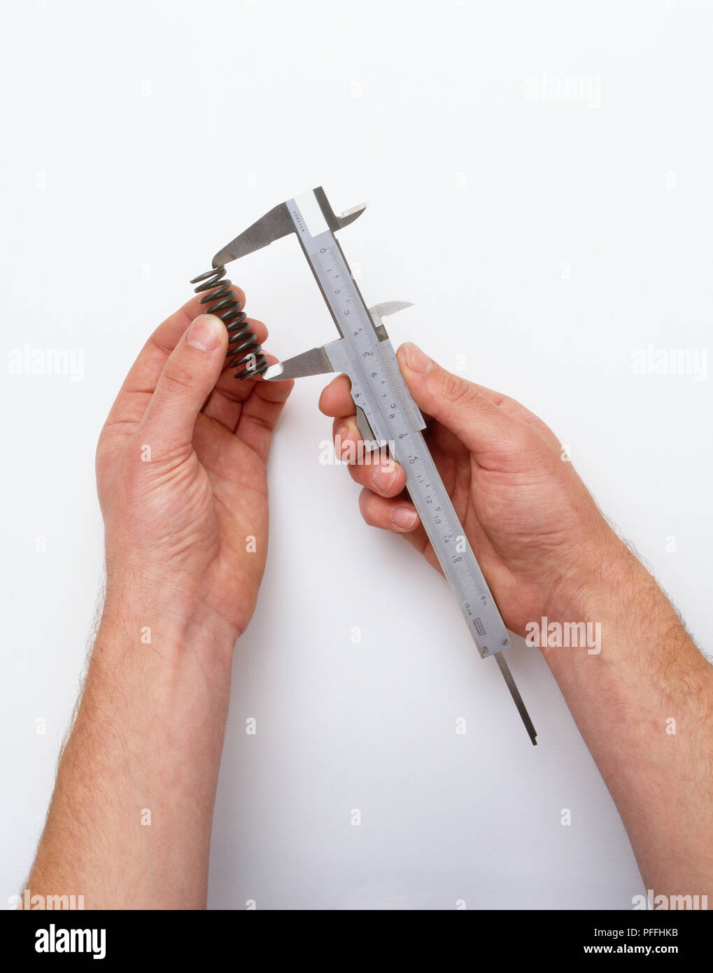 Using a Vernier gauge to measure a clutch spring Stock Photo Alamy