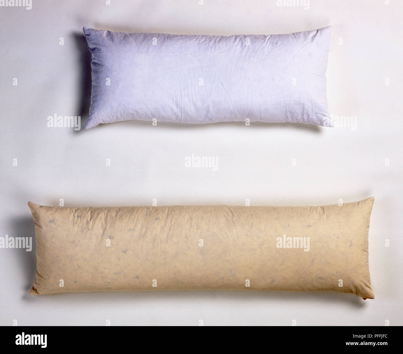 Feather and down bolsters, used as an alternative to pillows, above