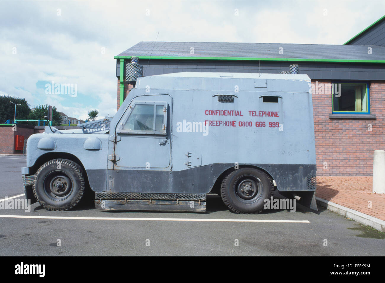 United Kingdom, Northern Ireland, armour-plated Land Rover in parking lot, side view. Stock Photo