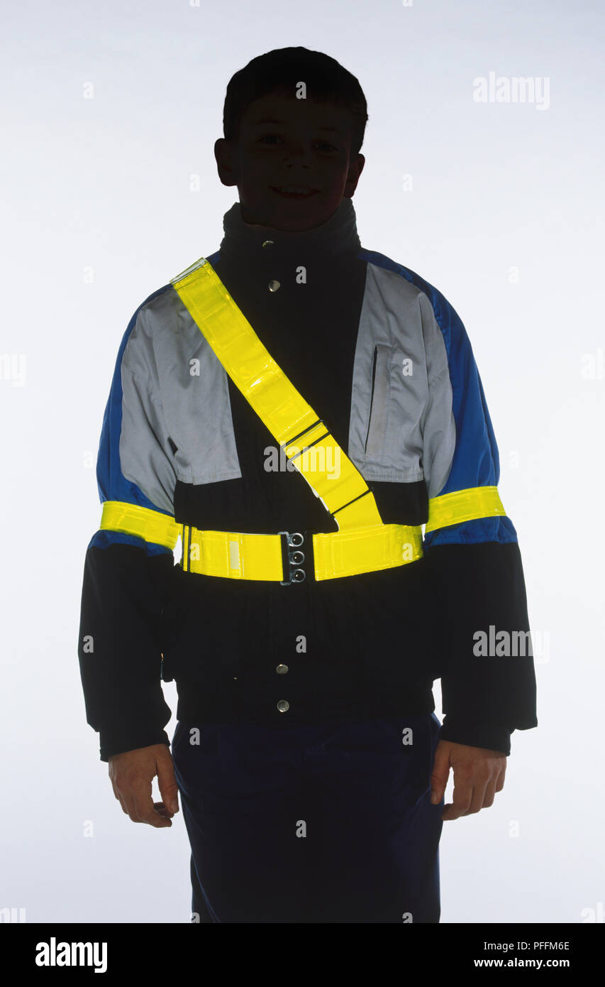 A boy wearing a glowinthedark safety harness Stock Photo Alamy