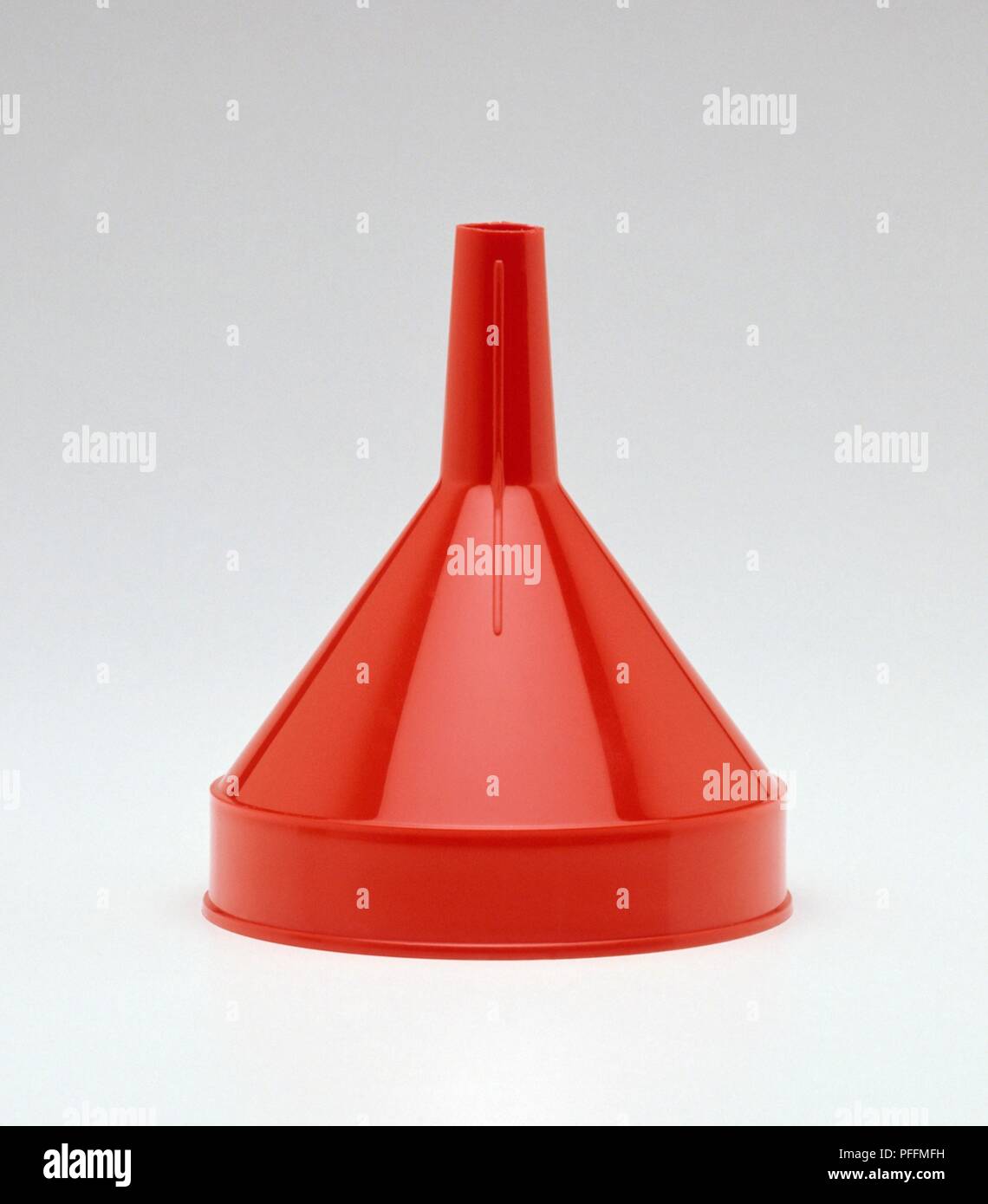 A red plastic funnel Stock Photo