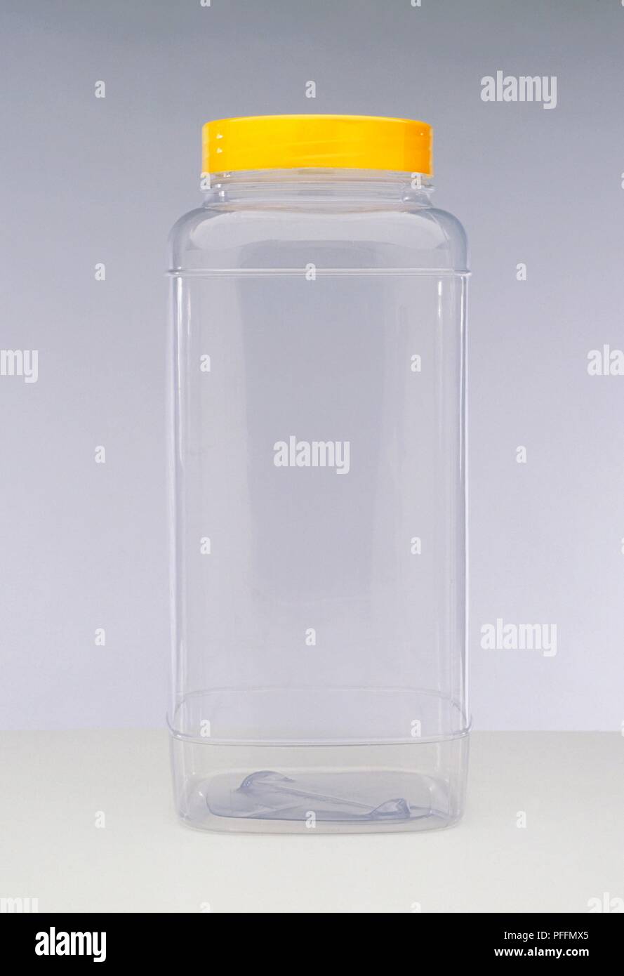 Empty jar with yellow lid Stock Photo Alamy