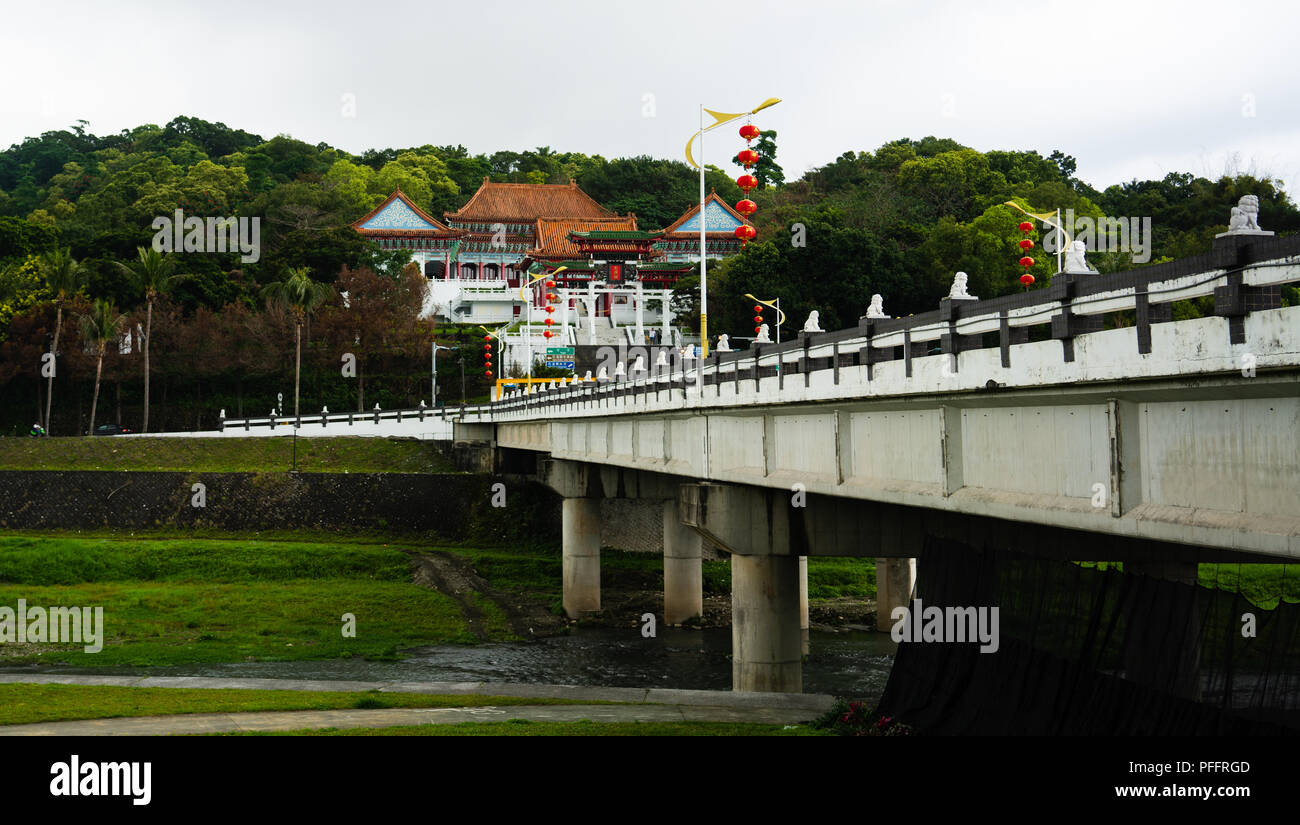 Bridge over Meilun river and Martyrs shrine in background in Hualien Taiwan Stock Photo