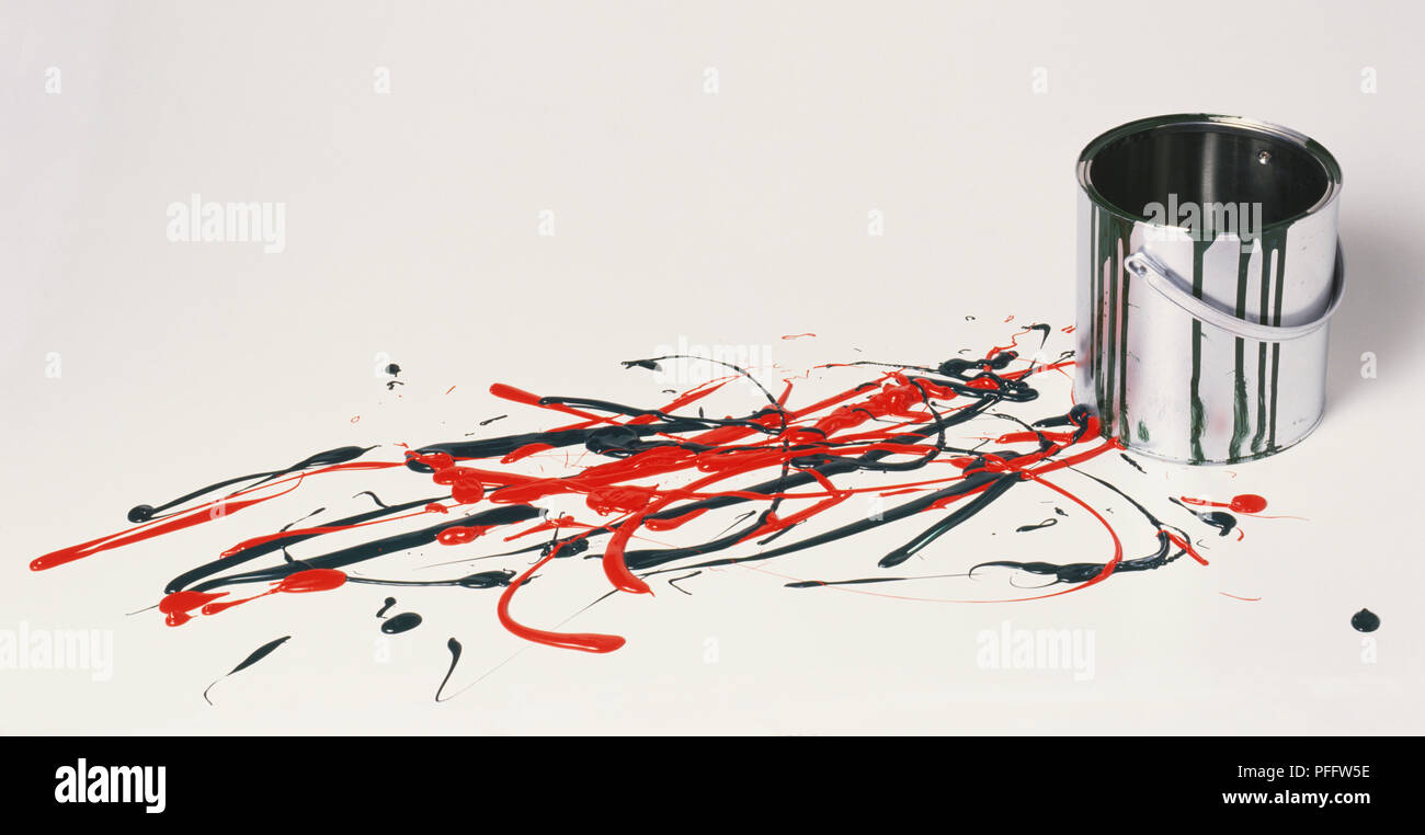 Open paint tin by colourful paint splats on floor Stock Photo Alamy