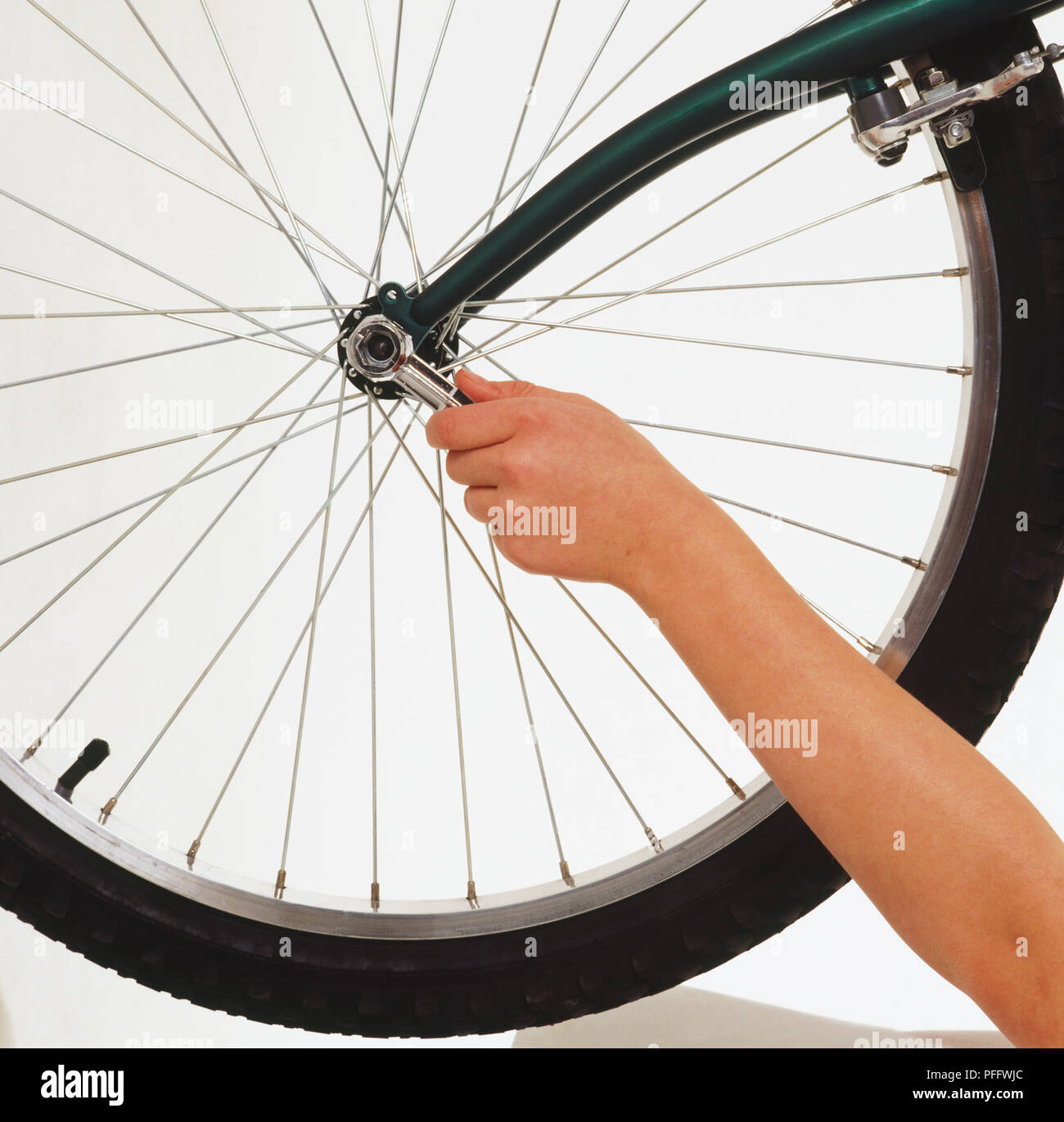 Loosening a wheel nut with a spanner Stock Photo Alamy