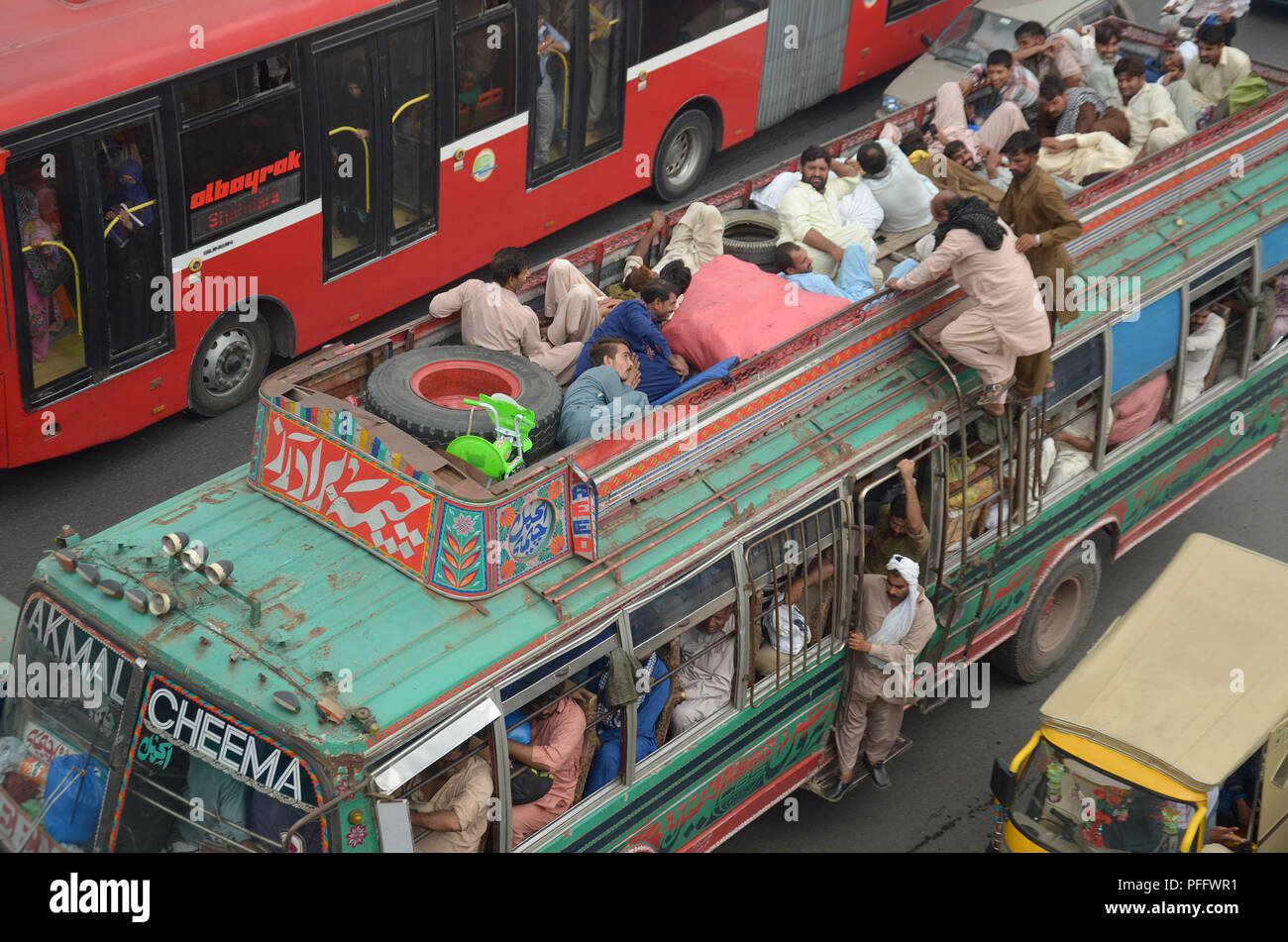 Pakistani passengers travel on a overcrowded bus to reach their villages  and cities to celebrate the upcoming Eid al-Adha Muslim holiday. This most  important Islamic holiday marks the willingness of the Prophet