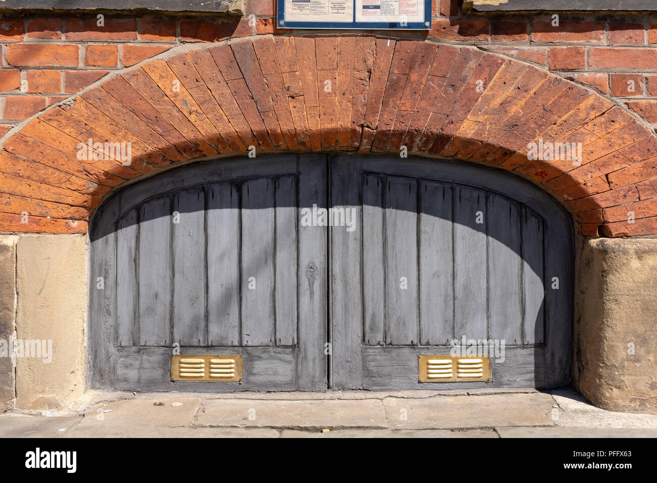 Image of Kingston Upon Hull UK City of Culture 2017. On Humber Dock is an old warehouse cellar door entrance. Stock Photo