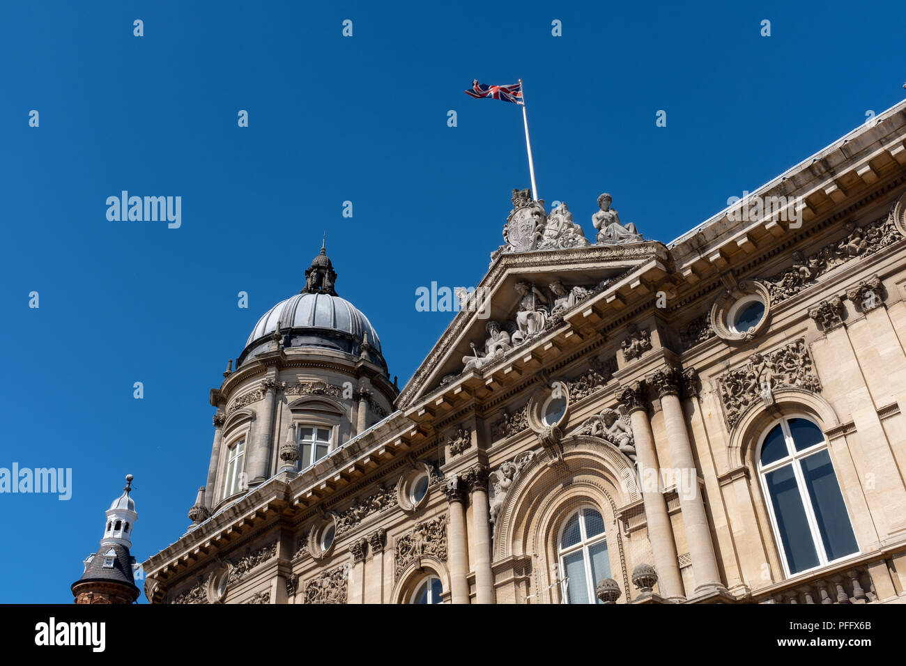 Image of Kingston Upon Hull UK City of Culture 2017. Town dock museum against a blue sky and the union flag flying. Stock Photo