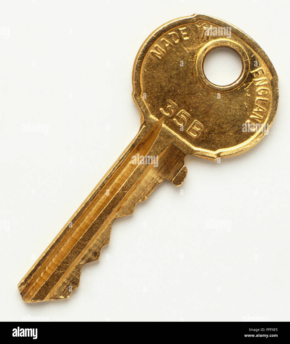 Gold coloured door key Stock Photo