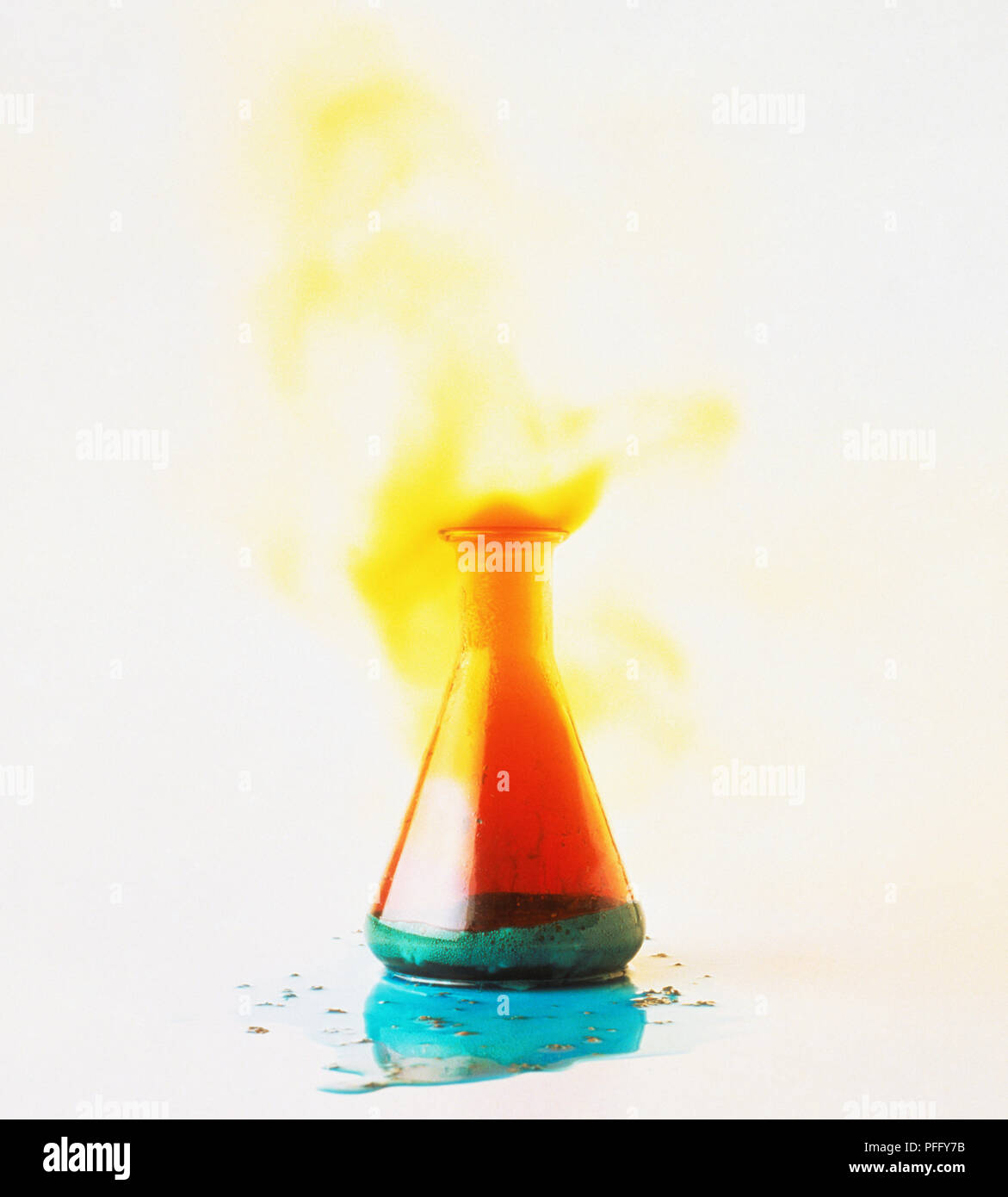 Chemical explosion in glass flask emitting orange fumes Stock Photo Alamy