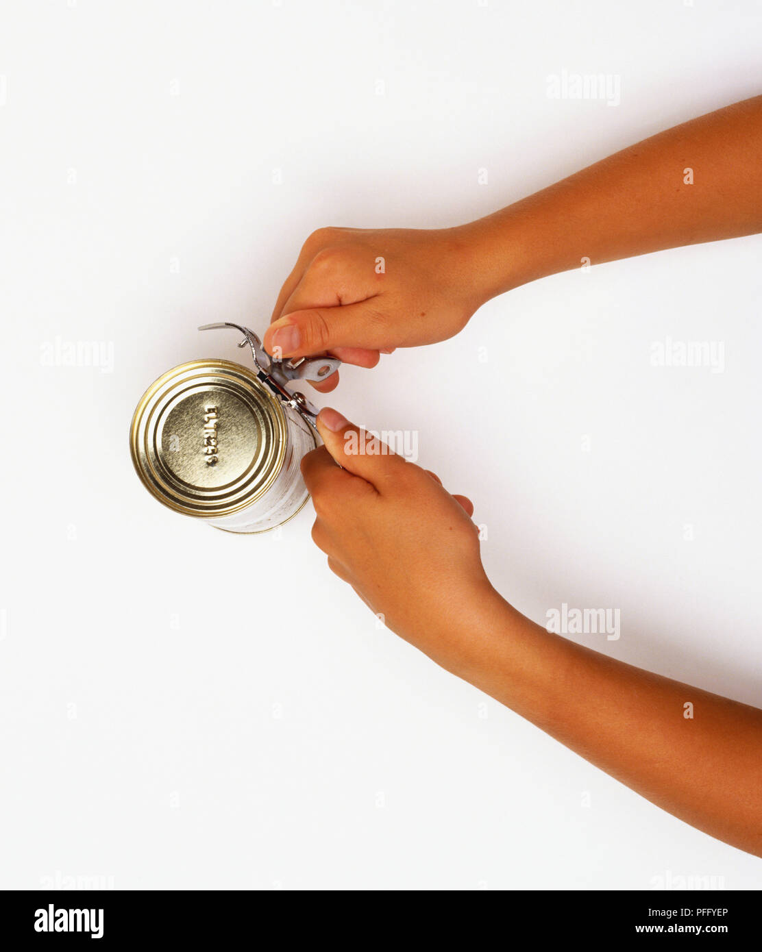 Using a can opener hires stock photography and images Alamy