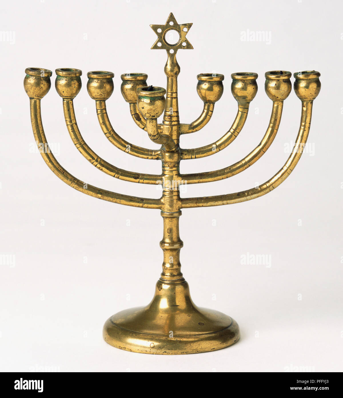 Jewish Menorah bronze candle holder. Stock Photo