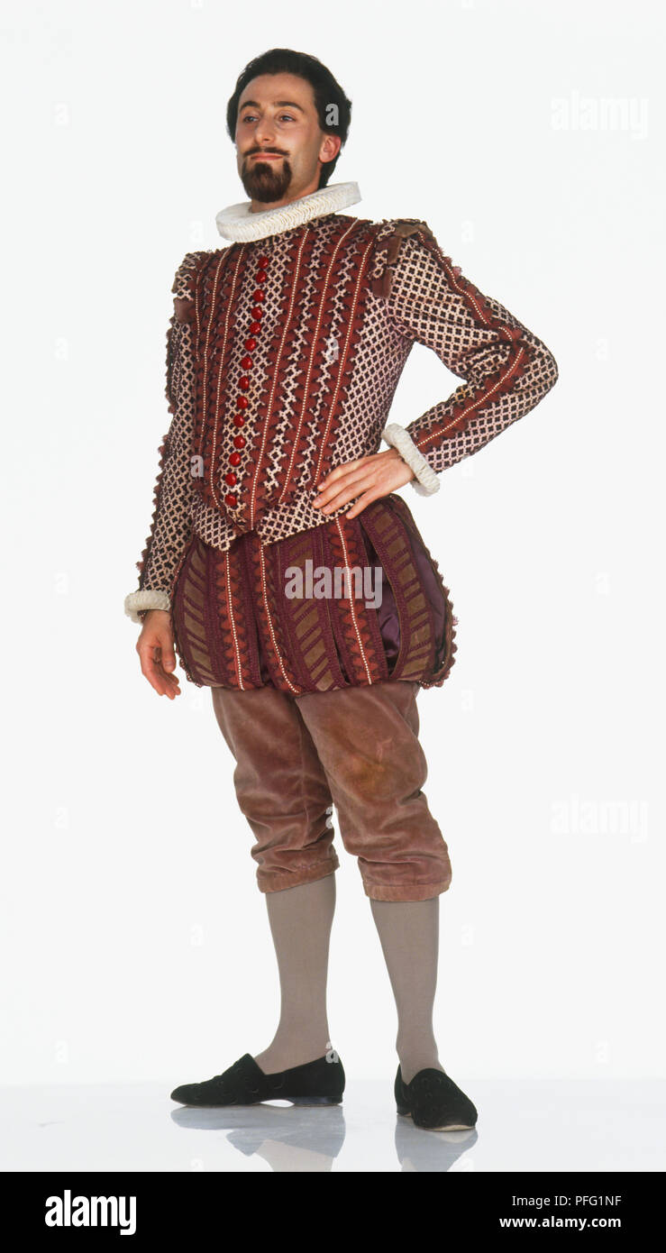 A man wearing a costume typical of the second half of the 16th century, including breeches, neck ruff and a padded short jacket Stock Photo