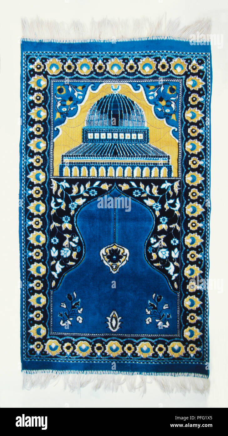 A blue muslim prayer mat with white tassels Stock Photo Alamy