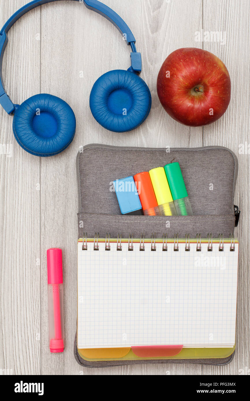School supplies. Open exercise book on bag-pencil case with color felt ...