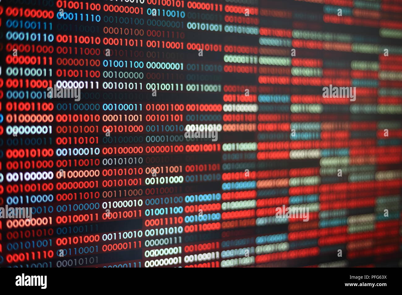 Computer infection. Rows of binary codes randomly colored red and blue on black screen monitor Corrupted data bad sector ha Stock Photo - Alamy