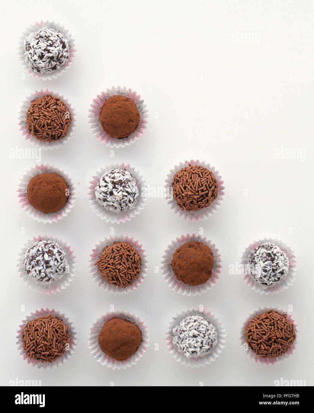 Chocolate truffles rolled in coconut, chocolate vermicelli and cocoa