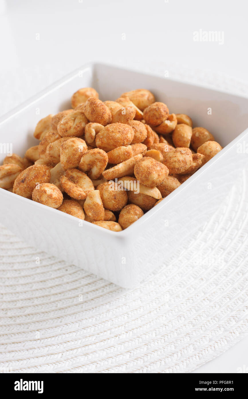 Dry or oven roasted peanuts lightly seasoned eaten as high protein snack Stock Photo