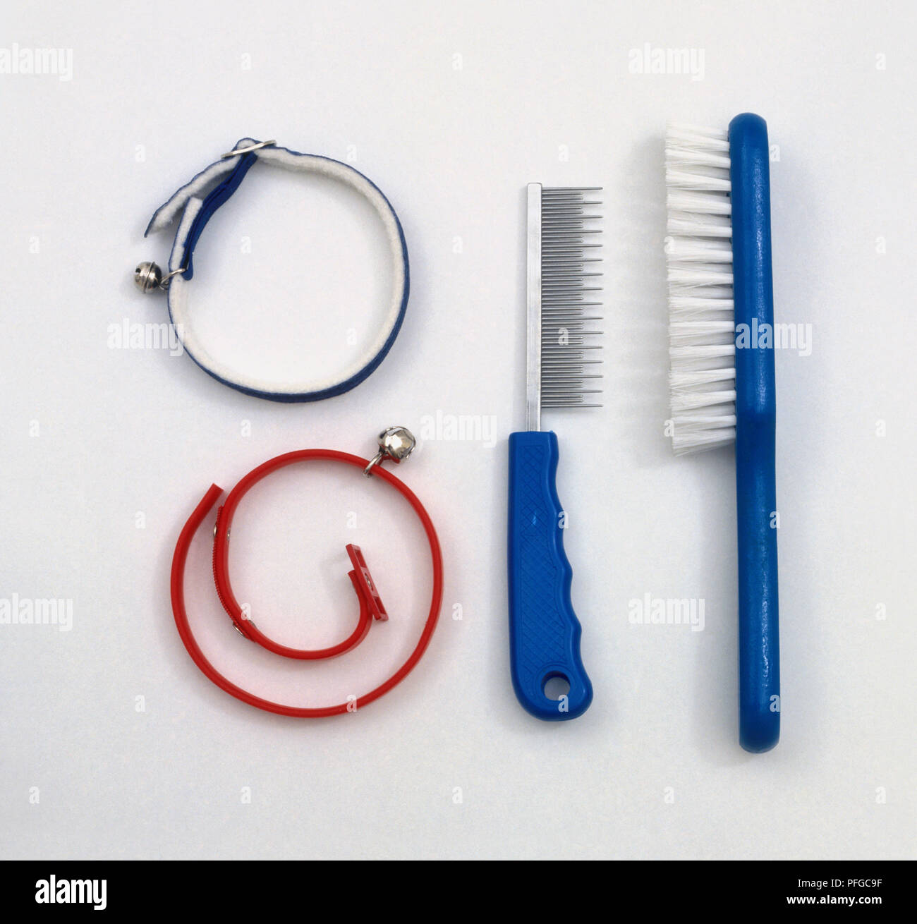 Blue Animal Brush And Cat Comb Red Flea Collar With Bell And Elasticated Cat Collar With Bell Stock Photo Alamy