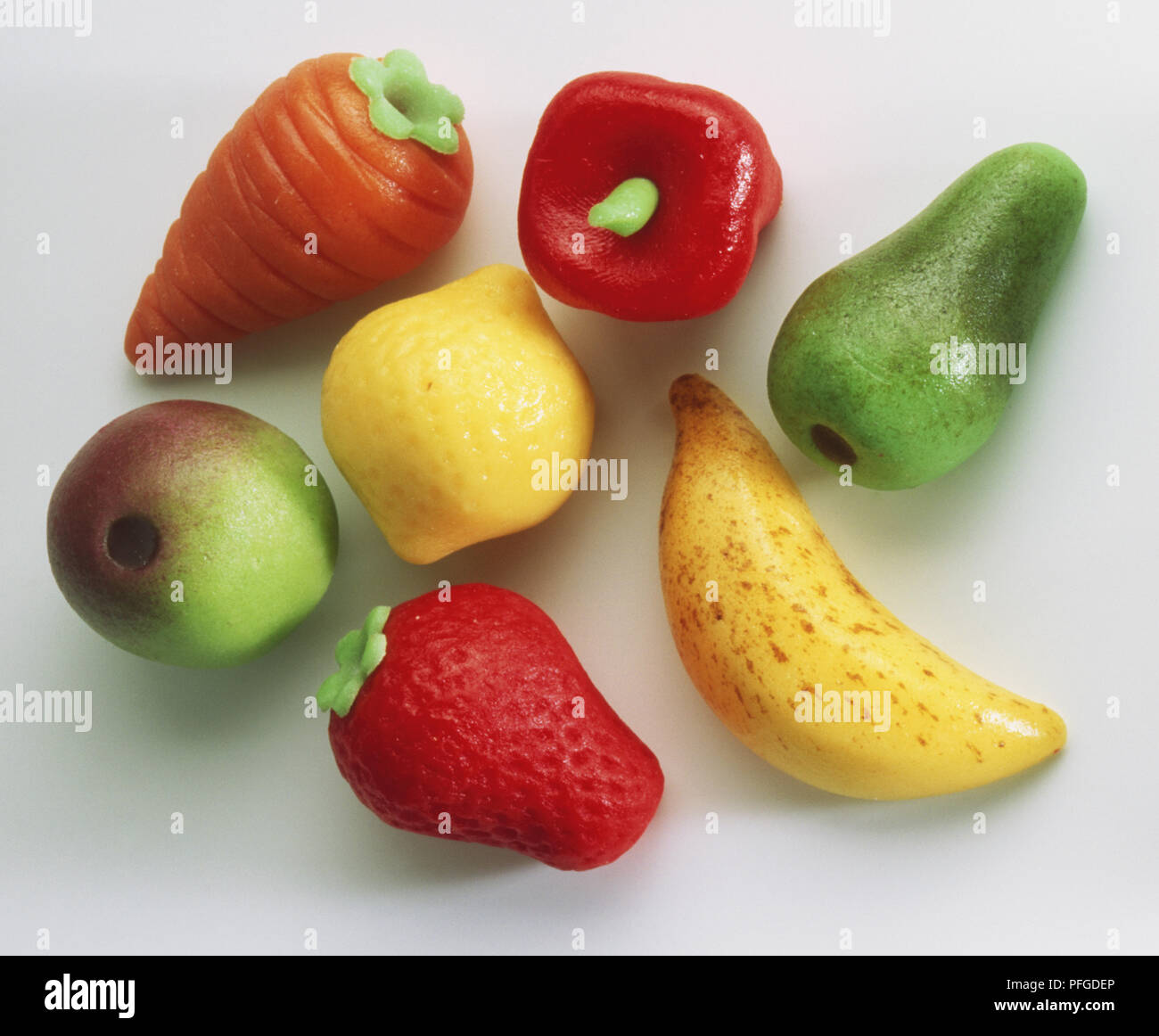 Colourful selection of marzipan sweets shaped as different fruit and vegetables, close up Stock Photo