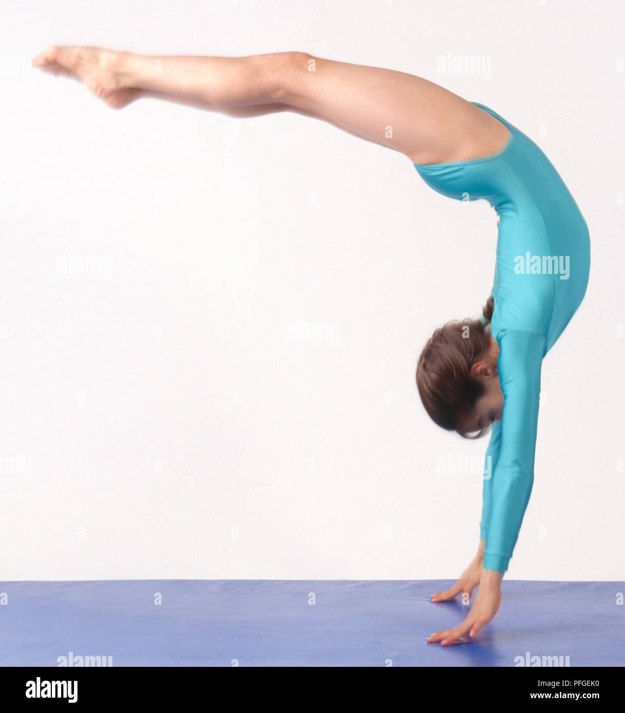Gymnast performing backflip, side view Stock Photo - Alamy