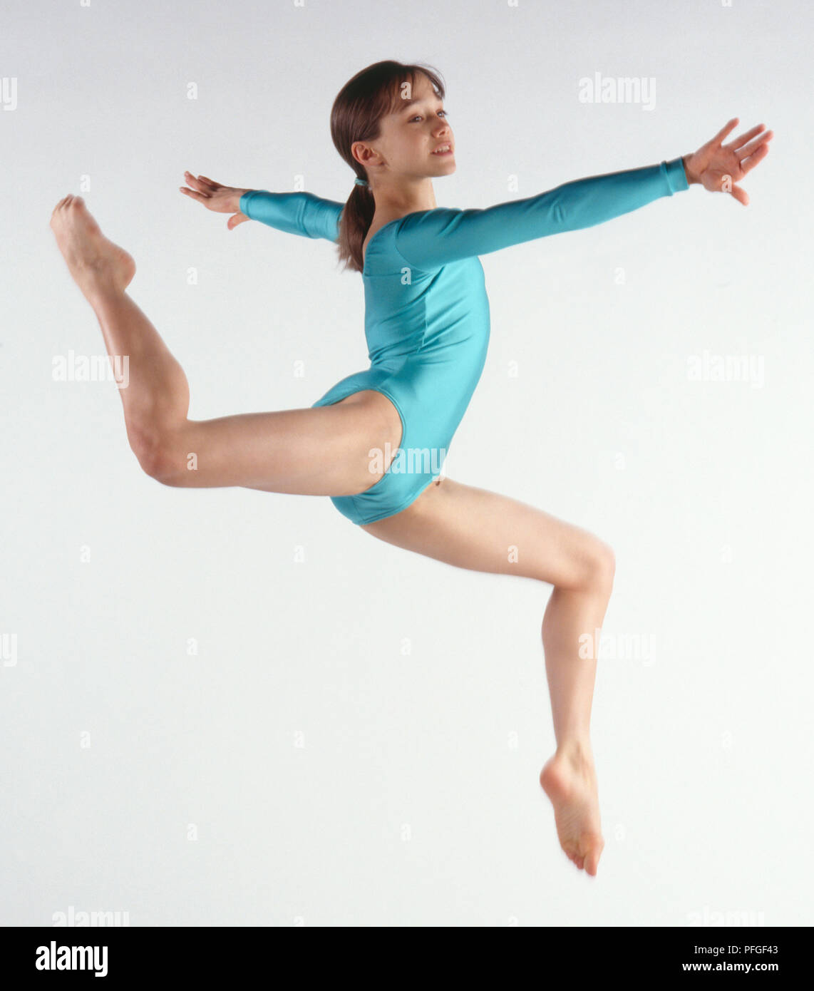 Gymnast performing stag leap Stock Photo Alamy