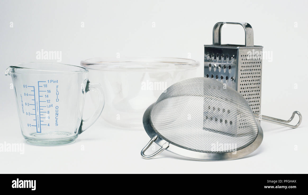 Measuring jug, mixing bowl, sieve and grater Stock Photo Alamy
