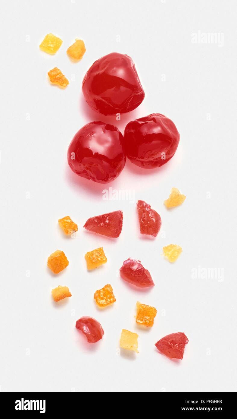 Whole and sliced glace Cherries, lemon and orange peel Stock Photo Alamy