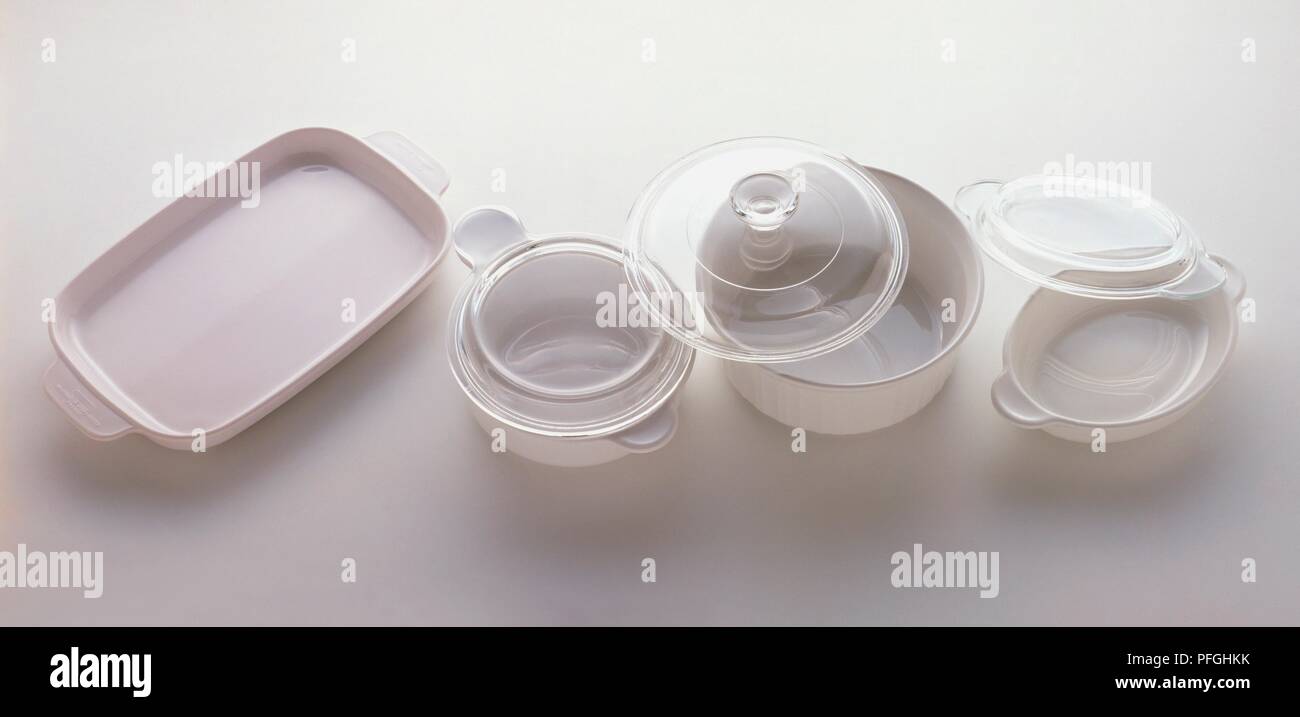 White ceramic kitchenware with glass lids Stock Photo Alamy