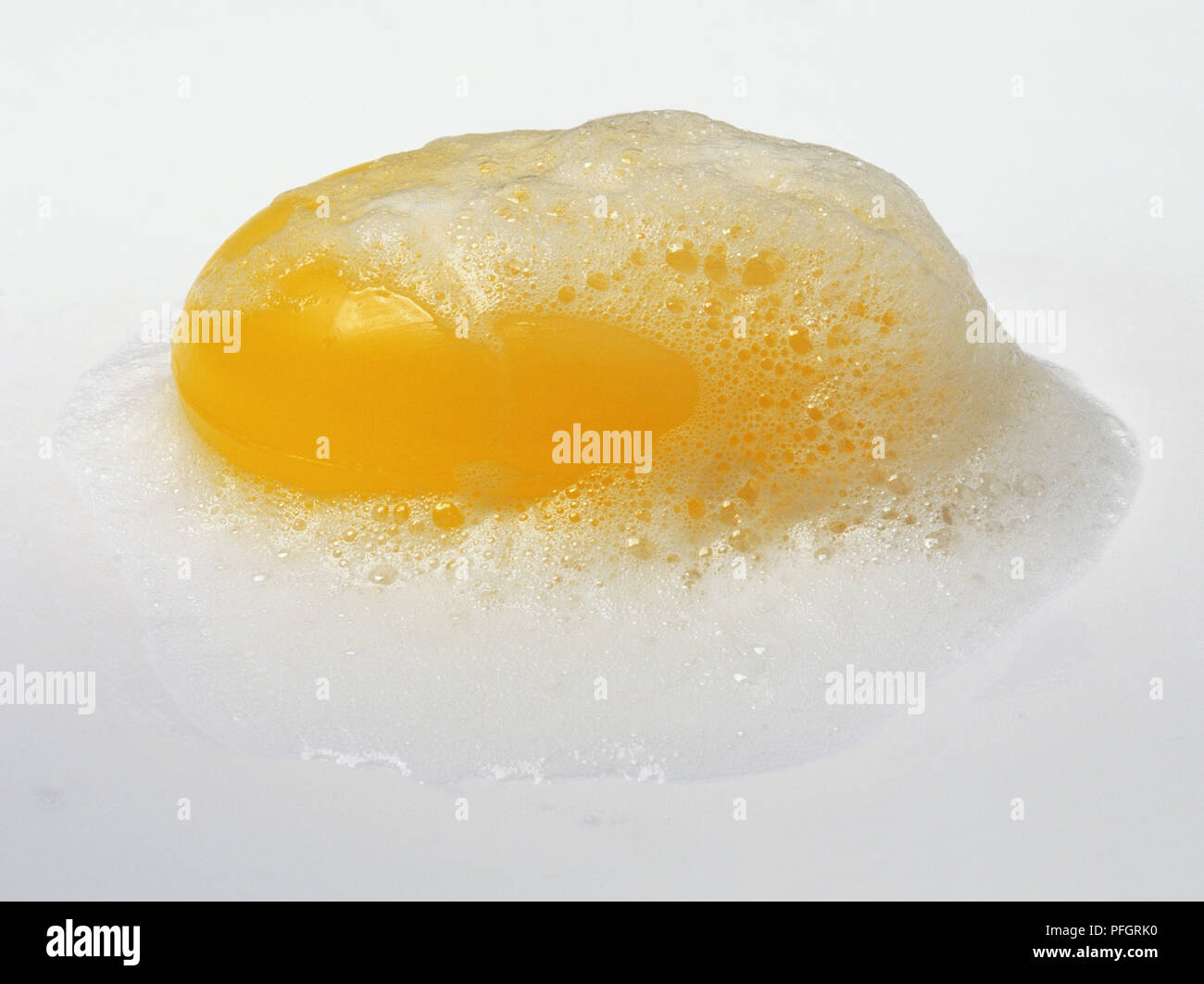 A yellow bar of soap covered in suds Stock Photo Alamy