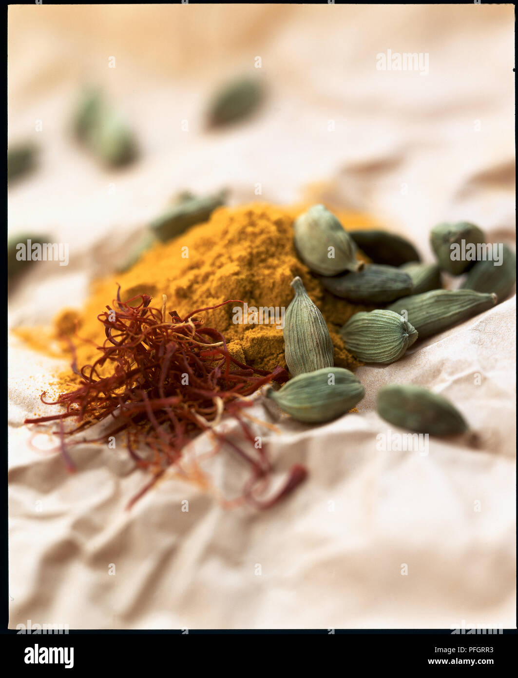 Spices, curry powder, saffron strands and cardamom pods Stock Photo Alamy
