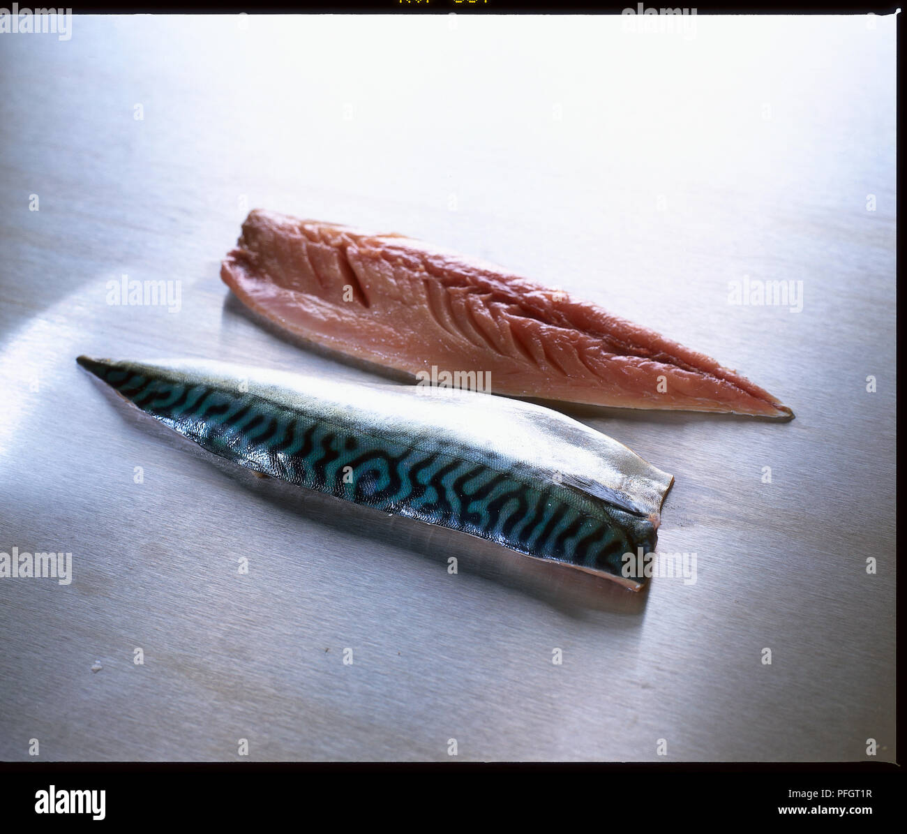 Fresh mackerel fillets showing skin and red flesh Stock Photo Alamy