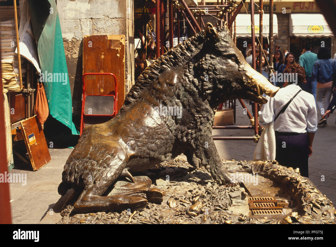 Italy, Florence, Mercato Nuovo, bronze sculpture of boar with gleaming nose thanks to a superstition that those who touch it will return to Florence. Stock Photo