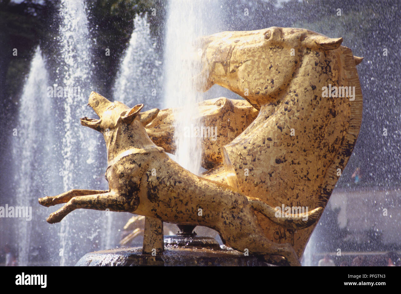France, Paris, golden statue of horses and wolves outside the Jardins