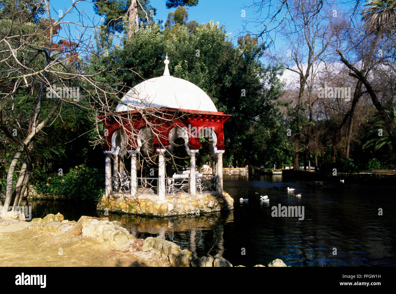 Spain, Seville, Parque Maria Luisa, Isleta de los Patos, ornamental domed gazebo on lake in the park Stock Photo