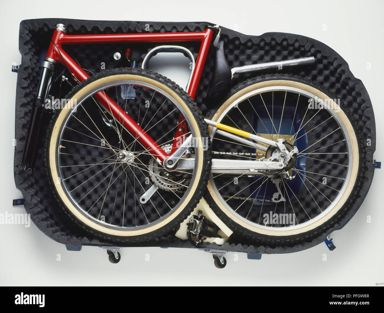 Disassembled parts of a mountain bike inside a bicycle case Stock