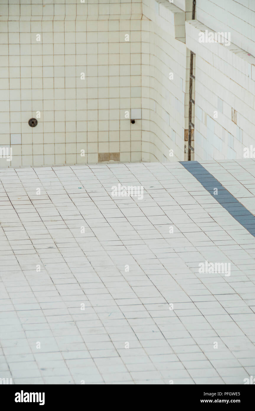 Abstract composition. White tiles. Abandoned swimming pool. Stock Photo