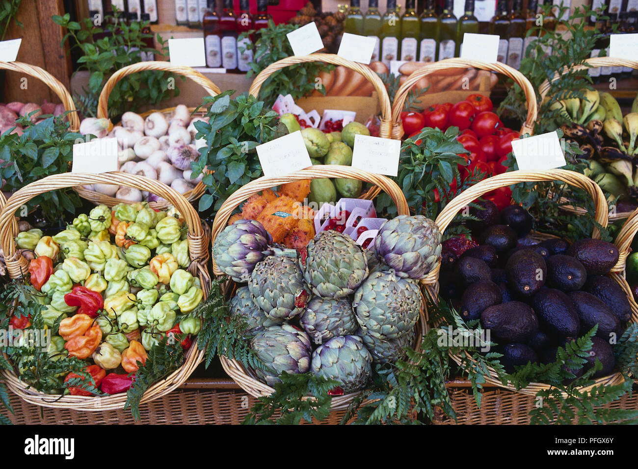 Baskets of vegetable on a market stall Stock Photo