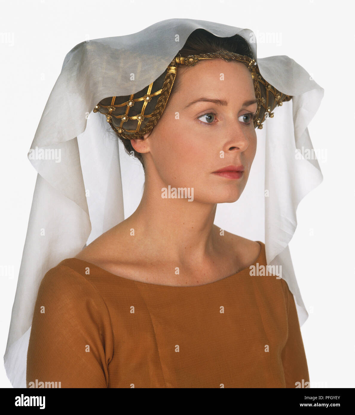 A woman with a veil over a horned headdress Stock Photo